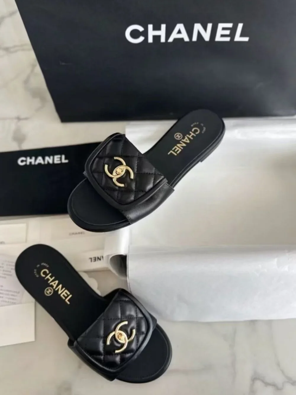 CHANEL Black Quilted Leather CC Turn‑Lock Flat Slide Sandals